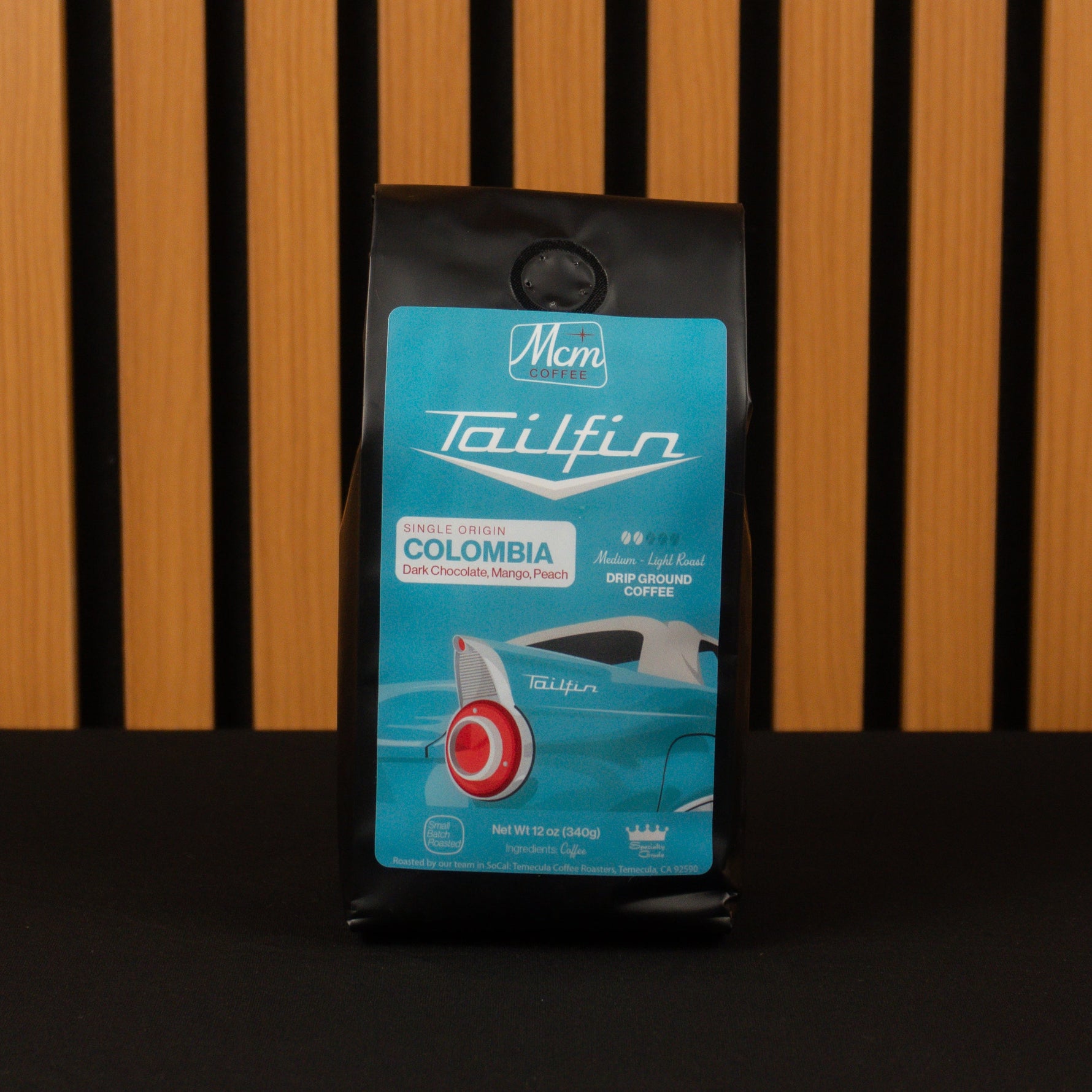 Tailfin Colombia coffee package on a wooden background
